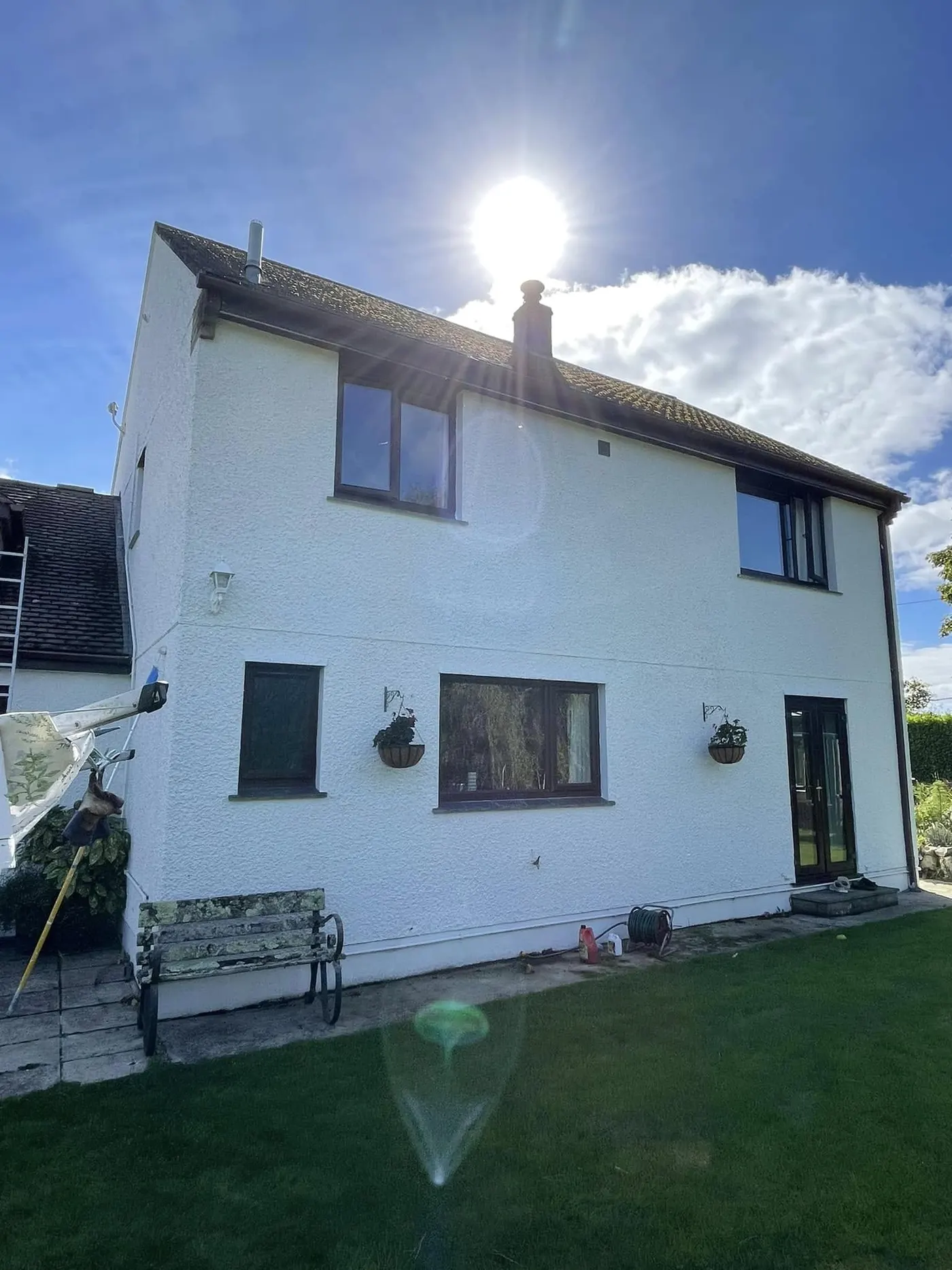 White-painted detached house in sunshine